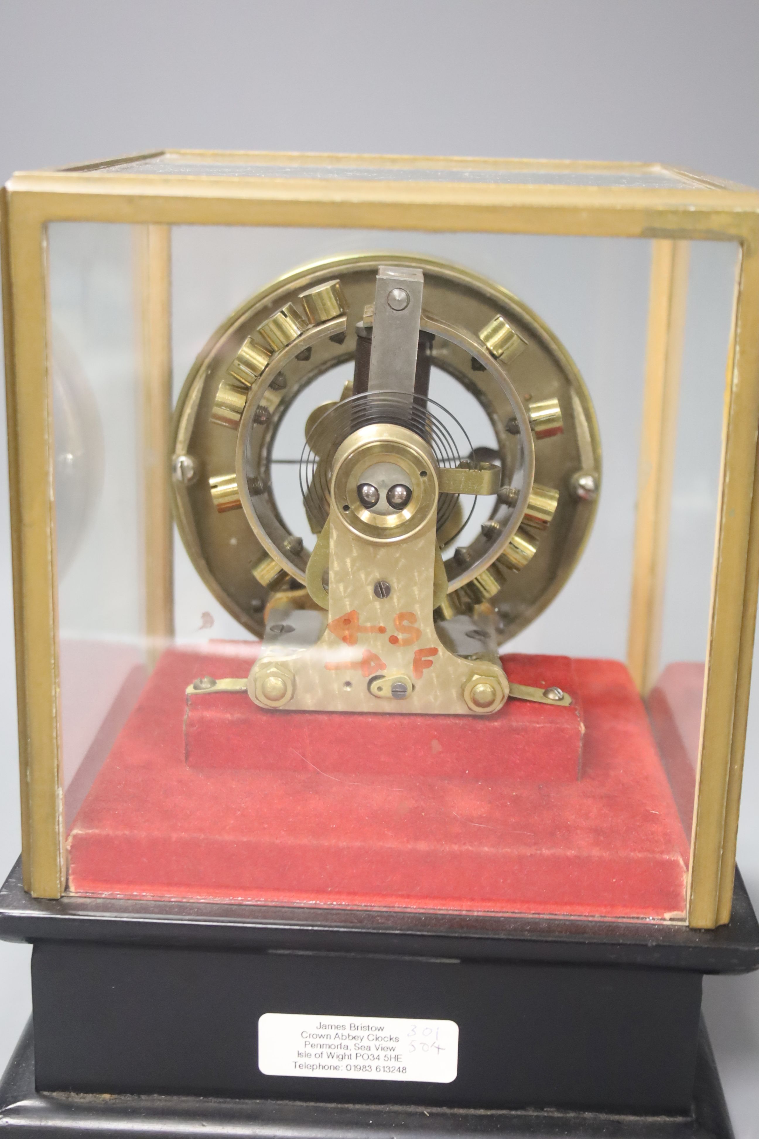 A Eureka Clock Co. Ltd electric clock in four glass case